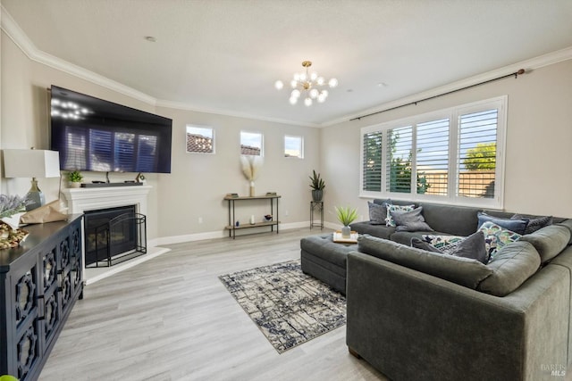 5340 Discovery Way, Fairfield, CA 94533 - living area featuring light wood finished floors, ornamental molding, a glass covered fireplace, a chandelier, and baseboards