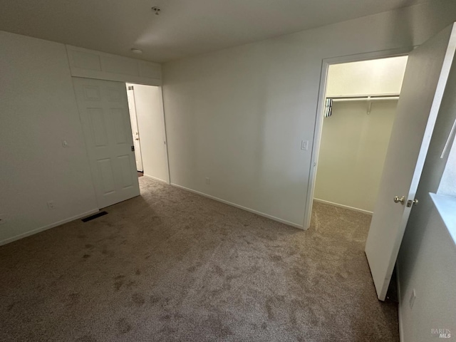 143 Sea Crest Cir, Vallejo, CA 94590 - unfurnished bedroom with carpet, a walk in closet, a closet, and baseboards