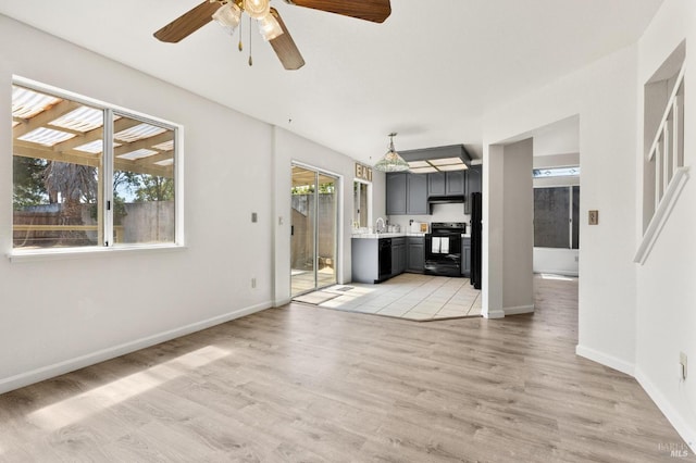 404 Mellowood Ct, Suisun City, CA 94585 - unfurnished living room featuring light wood-style flooring and a ceiling fan