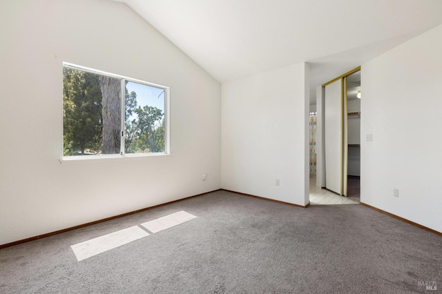 404 Mellowood Ct, Suisun City, CA 94585 - carpeted spare room featuring vaulted ceiling and baseboards