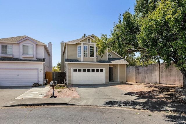 404 Mellowood Ct, Suisun City, CA 94585 - traditional home with driveway, a garage, and roof with shingles