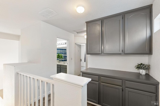 404 Mellowood Ct, Suisun City, CA 94585 - kitchen with gray cabinetry and dark countertops