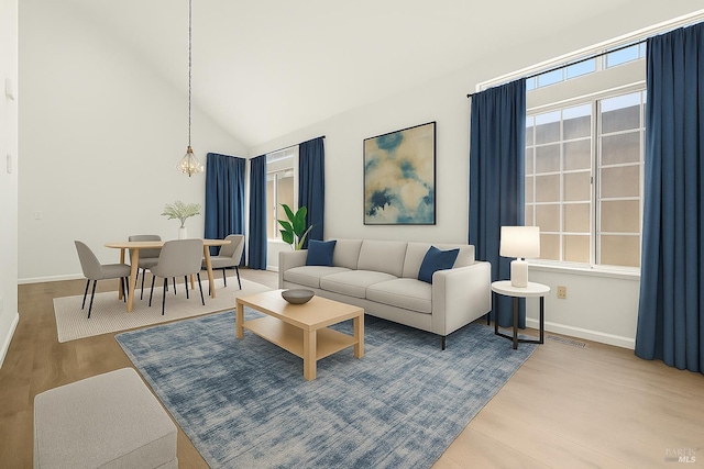 404 Mellowood Ct, Suisun City, CA 94585 - living room featuring wood finished floors, a chandelier, and high vaulted ceiling