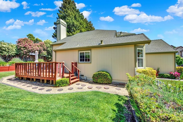2340 Canton Ct, Fairfield, CA 94534 - rear view of house with a deck, a yard, a chimney, and roof with shingles