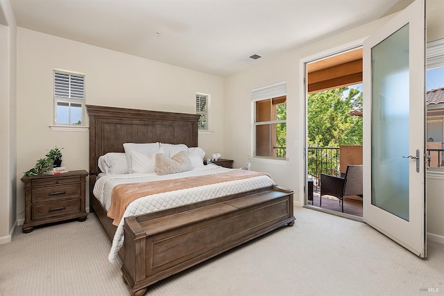 180 Healdsburg Ave Unit B, Cloverdale, CA 95425 - bedroom featuring light colored carpet, access to exterior, and multiple windows
