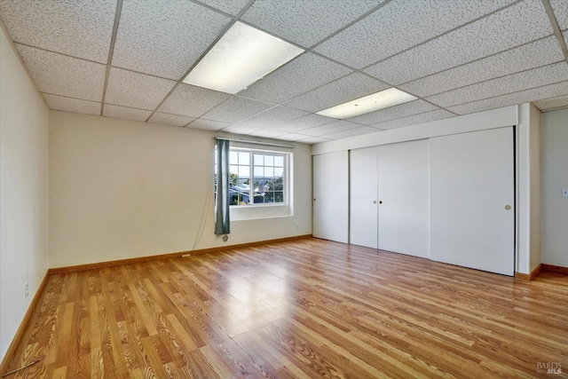 8567 Davona Dr, Dublin, CA 94568 - unfurnished bedroom with light wood finished floors, a paneled ceiling, and a closet