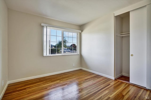 8567 Davona Dr, Dublin, CA 94568 - unfurnished bedroom featuring wood finished floors and a closet