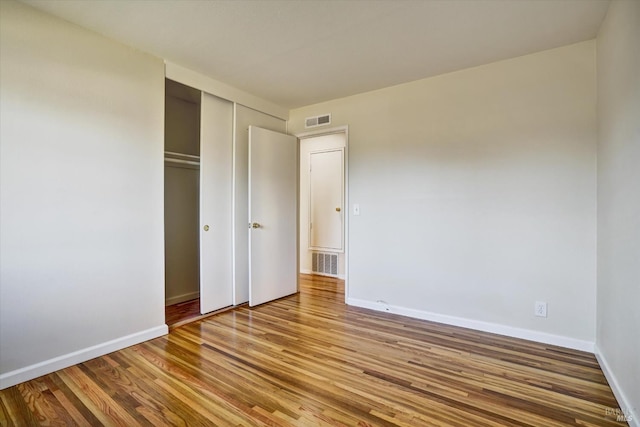 8567 Davona Dr, Dublin, CA 94568 - unfurnished bedroom with wood finished floors and a closet