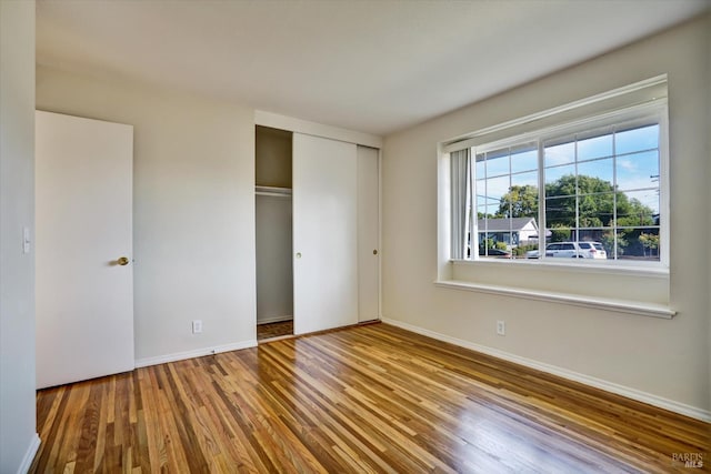 8567 Davona Dr, Dublin, CA 94568 - unfurnished bedroom with wood finished floors and a closet