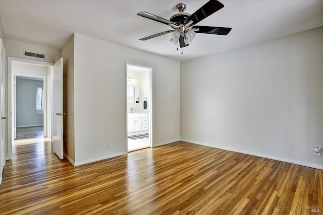 8567 Davona Dr, Dublin, CA 94568 - unfurnished bedroom featuring wood finished floors, ensuite bathroom, and a ceiling fan