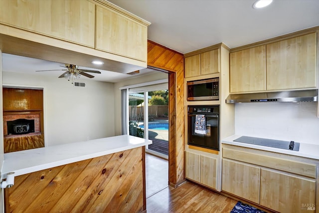 8567 Davona Dr, Dublin, CA 94568 - kitchen featuring black appliances, light brown cabinets, under cabinet range hood, light countertops, and ceiling fan