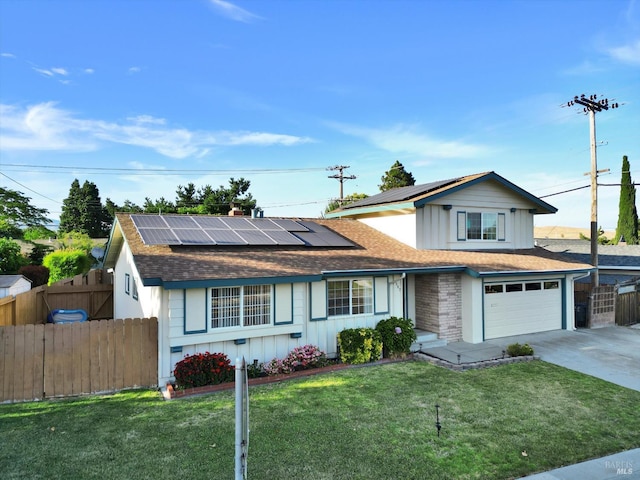 8567 Davona Dr, Dublin, CA 94568 - traditional-style house featuring board and batten siding, a shingled roof, concrete driveway, and roof mounted solar panels