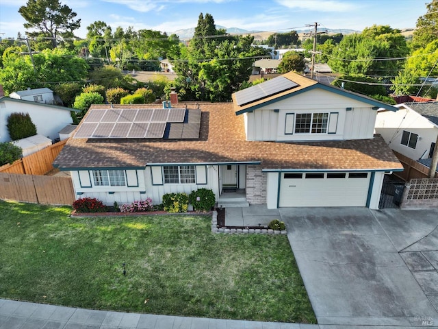 8567 Davona Dr, Dublin, CA 94568 - view of front of property featuring board and batten siding, concrete driveway, solar panels, a garage, and a shingled roof