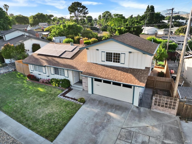 8567 Davona Dr, Dublin, CA 94568 - single story home featuring roof with shingles, concrete driveway, brick siding, a garage, and solar panels