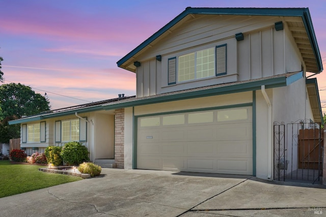 8567 Davona Dr, Dublin, CA 94568 - traditional home with board and batten siding, concrete driveway, an attached garage, and a front yard