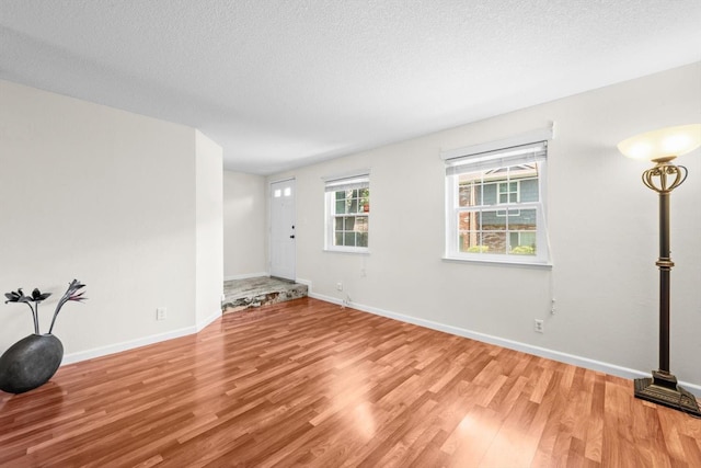 4014 Knoll Top Ct, Carmichael, CA 95608 - unfurnished room featuring light wood-type flooring and a textured ceiling