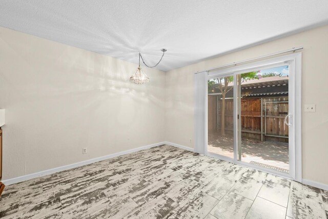 4014 Knoll Top Ct, Carmichael, CA 95608 - unfurnished dining area featuring a chandelier and a textured ceiling