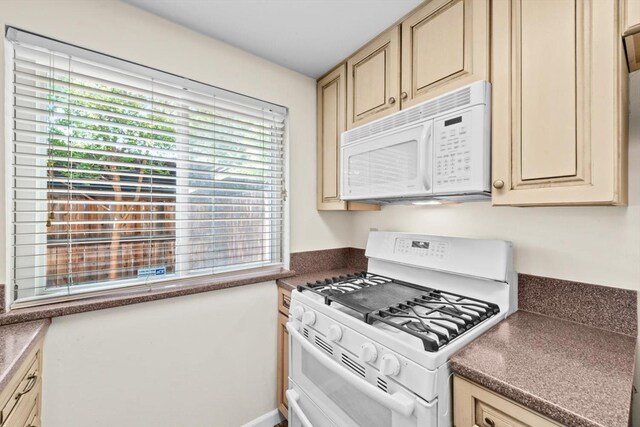 4014 Knoll Top Ct, Carmichael, CA 95608 - kitchen with white appliances, cream cabinets, and dark countertops