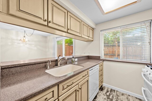 4014 Knoll Top Ct, Carmichael, CA 95608 - kitchen featuring white appliances, cream cabinetry, dark countertops, and healthy amount of natural light
