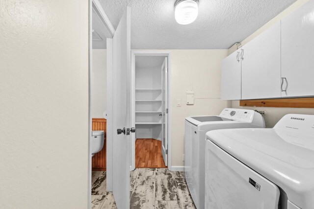 4014 Knoll Top Ct, Carmichael, CA 95608 - washroom featuring washer and clothes dryer, cabinet space, and a textured ceiling