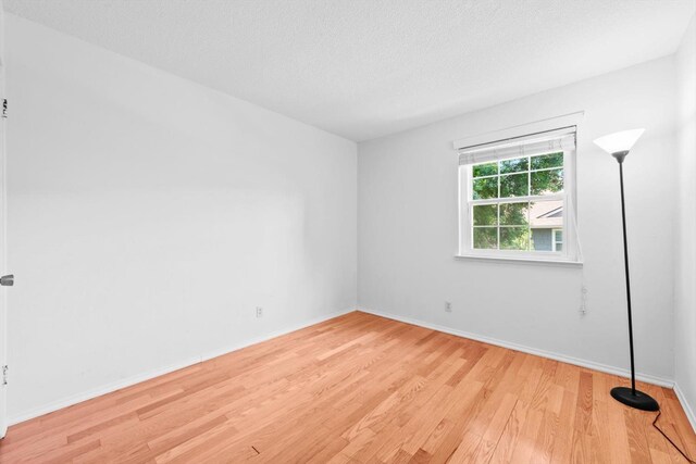 4014 Knoll Top Ct, Carmichael, CA 95608 - unfurnished room with light wood finished floors and a textured ceiling