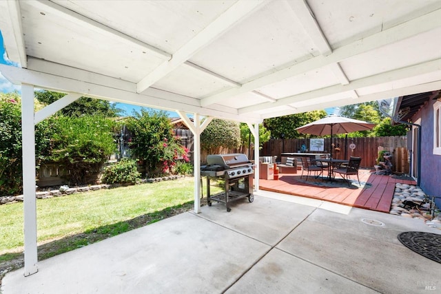 216 Walnut St, Suisun City, CA 94585 - fenced backyard with outdoor dining area, a wooden deck, a grill, and a patio area