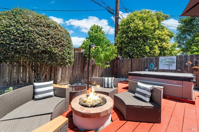 216 Walnut St, Suisun City, CA 94585 - deck featuring a hot tub, a fire pit, and a fenced backyard