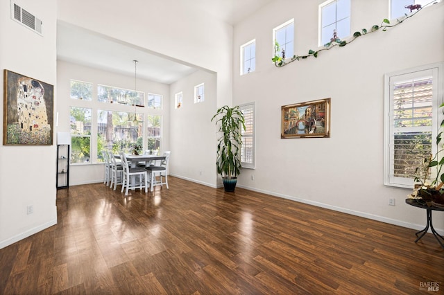 2131 Hailstone Way, Antioch, CA 94509 - dining space with a towering ceiling, wood finished floors, healthy amount of natural light, and a chandelier