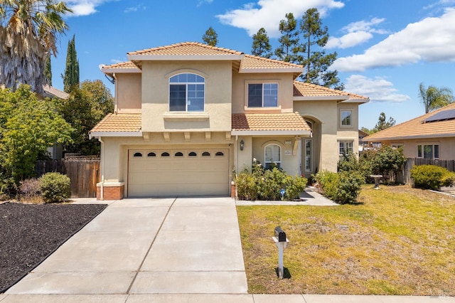 2131 Hailstone Way, Antioch, CA 94509 - mediterranean / spanish home featuring a tiled roof, stucco siding, an attached garage, and driveway
