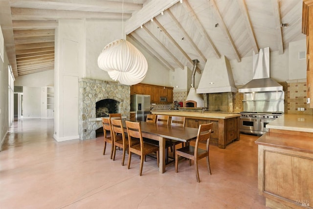 11018 Moonshine Rd, Sebastopol, CA 95472 - dining area featuring a fireplace, high vaulted ceiling, finished concrete flooring, and beam ceiling