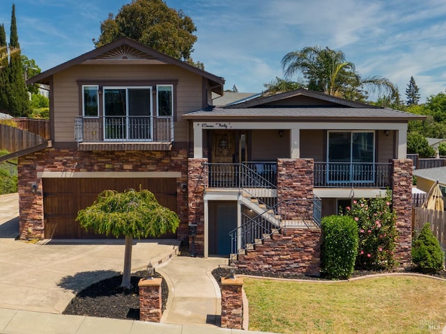 1130 W 9th St, Benicia, CA 94510 - view of front of house featuring stairway, a garage, concrete driveway, covered porch, and stone siding