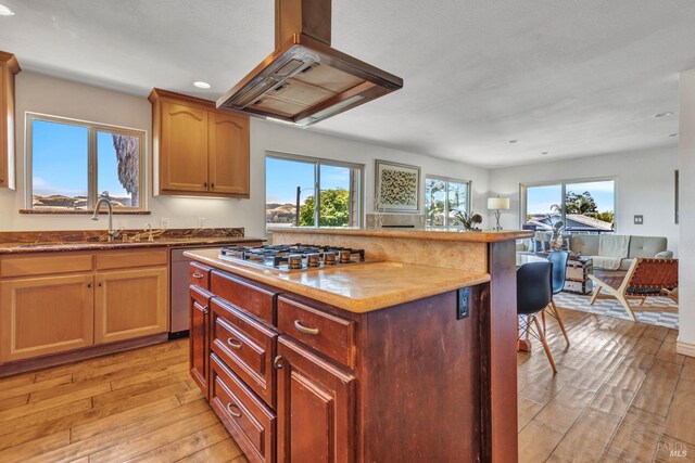 1130 W 9th St, Benicia, CA 94510 - kitchen featuring island range hood, stainless steel appliances, light wood-type flooring, open floor plan, and recessed lighting