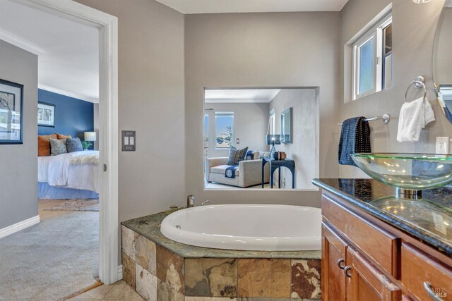 1130 W 9th St, Benicia, CA 94510 - bathroom featuring connected bathroom, healthy amount of natural light, crown molding, vanity, and a garden tub