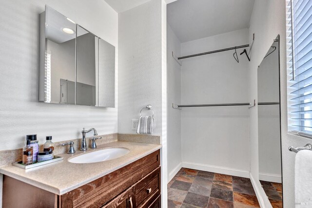 1130 W 9th St, Benicia, CA 94510 - bathroom with stone finish floors and vanity