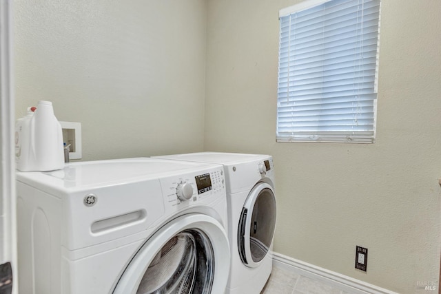 1130 W 9th St, Benicia, CA 94510 - laundry room with washer and clothes dryer and light tile patterned floors