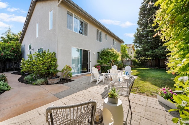 479 Jasper Ct, Benicia, CA 94510 - rear view of house featuring a fenced backyard, stucco siding, and a patio area