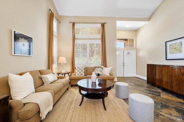 479 Jasper Ct, Benicia, CA 94510 - living room featuring stone tile flooring and a towering ceiling