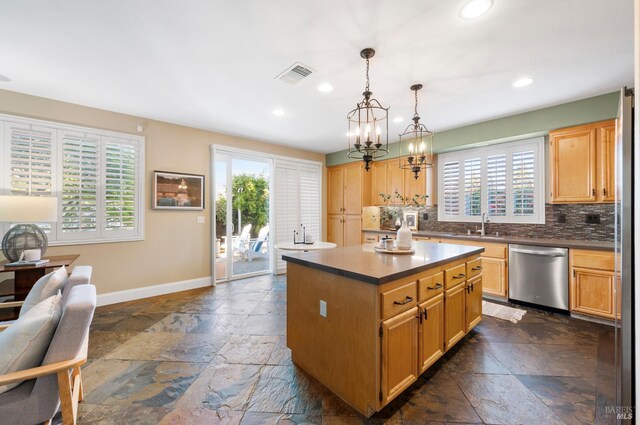 479 Jasper Ct, Benicia, CA 94510 - kitchen featuring dishwasher, stone tile flooring, recessed lighting, tasteful backsplash, and a kitchen island