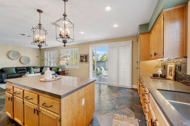 479 Jasper Ct, Benicia, CA 94510 - kitchen featuring recessed lighting, stone tile floors, a chandelier, tasteful backsplash, and open floor plan