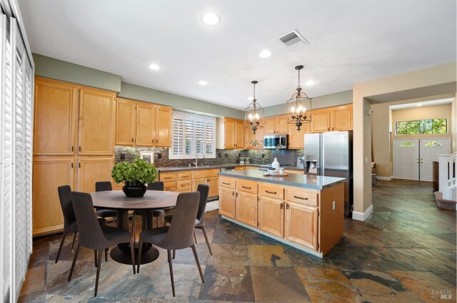 479 Jasper Ct, Benicia, CA 94510 - kitchen featuring appliances with stainless steel finishes, stone tile flooring, healthy amount of natural light, and recessed lighting