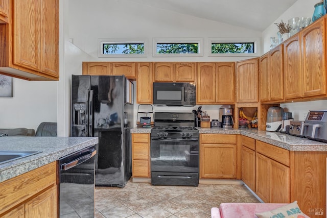 2720 Laurel St, Napa, CA 94558 - kitchen featuring black appliances, lofted ceiling, tile countertops, and light tile patterned flooring