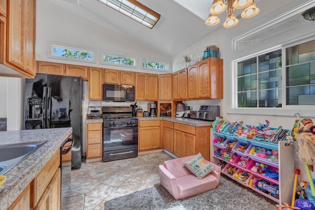 2720 Laurel St, Napa, CA 94558 - kitchen featuring black appliances, high vaulted ceiling, a chandelier, and light countertops
