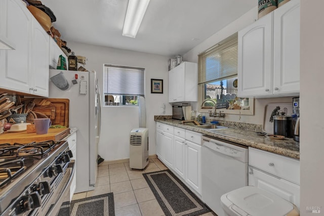 2720 Laurel St, Napa, CA 94558 - kitchen with white dishwasher, gas range, white cabinetry, and light tile patterned floors