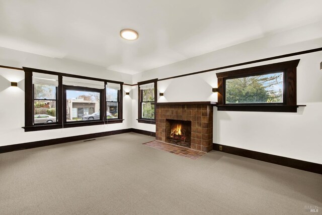 1763 2nd St, Napa, CA 94559 - unfurnished living room featuring carpet flooring, a tile fireplace, and plenty of natural light