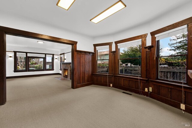 1763 2nd St, Napa, CA 94559 - carpeted spare room featuring a fireplace with flush hearth and wood walls