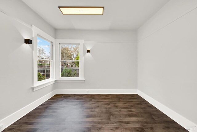 1763 2nd St, Napa, CA 94559 - empty room with dark wood-style flooring and baseboards