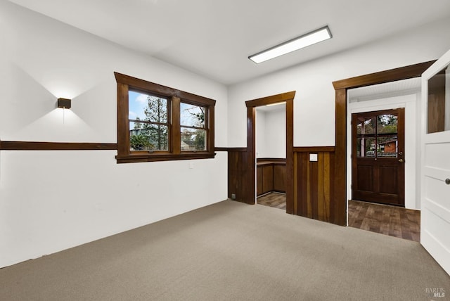 1763 2nd St, Napa, CA 94559 - empty room featuring carpet, wainscoting, healthy amount of natural light, and wooden walls