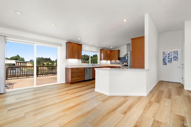 2290 Woolsey Rd, Fulton, CA 95439 - kitchen featuring brown cabinetry, stainless steel dishwasher, light countertops, light wood-style floors, and a peninsula
