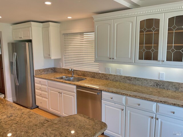 164 Oak Island Dr, Santa Rosa, CA 95409 - kitchen with appliances with stainless steel finishes, white cabinets, recessed lighting, glass insert cabinets, and light stone counters