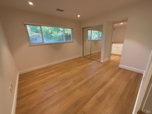 164 Oak Island Dr, Santa Rosa, CA 95409 - unfurnished bedroom featuring light wood-style floors, recessed lighting, and a closet